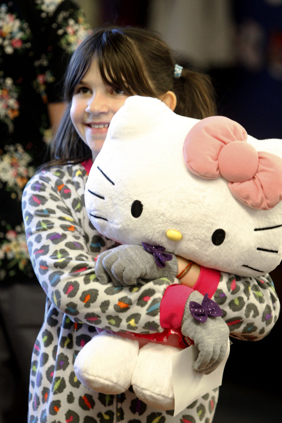 Kaitlyn Cermak hugs her new Hello Kitty doll